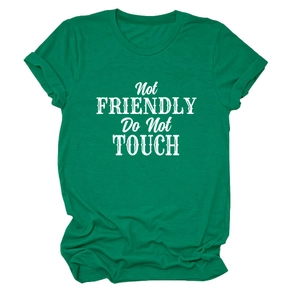 Detail of green crew neck T-shirt featuring bold white 'Not FRIENDLY' printed text