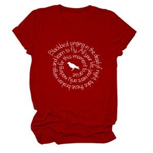 Detailed view of white song lyrics and bird silhouette print on dark red cotton t-shirt