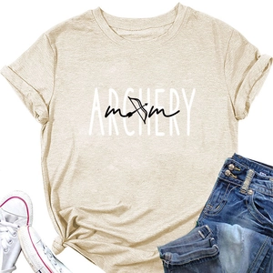 Flat lay of beige Archery Mom t-shirt styled with denim shorts and white sneakers