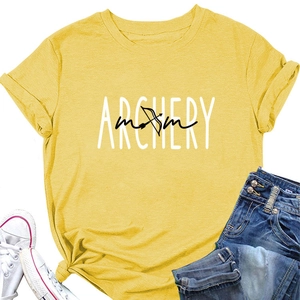 Flat lay of bright yellow Archery Mom t-shirt with denim shorts and white sneakers