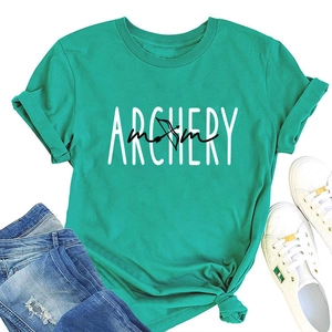 Flat lay of a mint green Archery Mom t-shirt paired with jeans and white sneakers