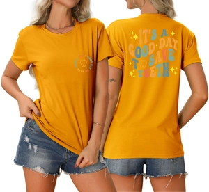 Close-up of retro letter print and tooth icon on the back of a ginger crew neck T-shirt