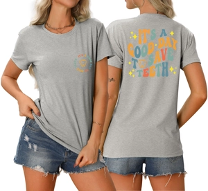 Close-up of the vintage dental slogan and colorful tooth graphic on a grey t-shirt