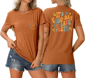 Detail of caramel dentist t-shirt featuring 'It's a good day to save teeth' graphic