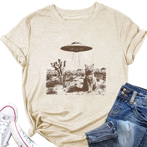 Close-up of oatmeal T-shirt featuring vintage UFO, desert cactus and cat graphic print