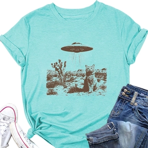 Close-up of mint green cotton T-shirt featuring a retro UFO and cat graphic print