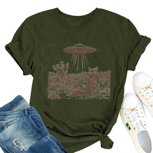 Flat lay of olive green cat and UFO print t-shirt paired with ripped denim jeans