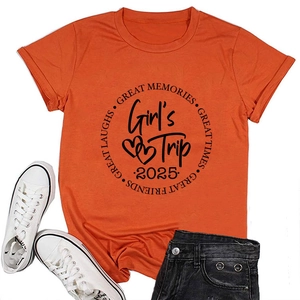 Détail du t-shirt orange avec imprimé Great Memories et Girl's Trip 2025 sur coton