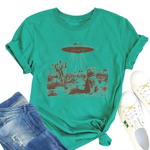Flat lay of a teal cotton t-shirt with retro cat and UFO print, jeans and white sneakers