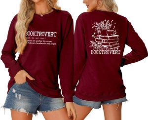 Front and back view of maroon Booktrovert sweatshirt with floral and coffee graphic
