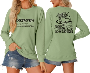 Front and back detail of sage green Booktrovert sweatshirt with graphic book illustrations