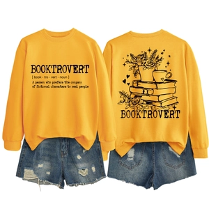 Detail of Booktrovert yellow sweatshirt and ripped denim shorts set with back graphic print
