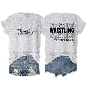 Close-up of gray Wrestling Mom t-shirt and distressed denim shorts showing fabric texture