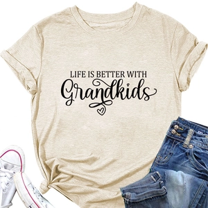 Detail of apricot T-shirt with Life is Better with Grandkids print and knotted hem