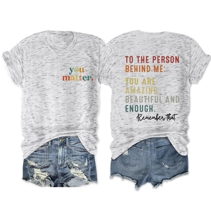 Flat lay view showing the front and back details of the gray T-shirt and denim shorts set