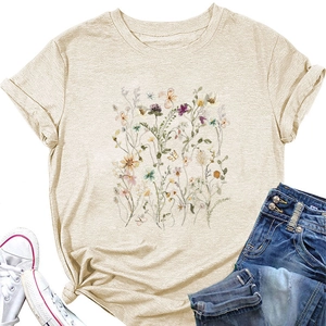 Detail of floral print beige t-shirt with rolled sleeves and side knot hem styling