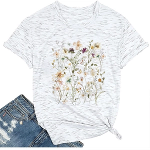 Close-up of elegant floral print t-shirt featuring side-knot hem detail and crew neck