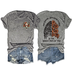 Front and back view of grey floral skull t-shirt with inspirational quote text