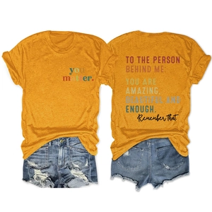 Detail of inspirational back print on mustard yellow t-shirt with denim shorts set