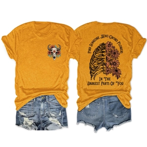 Detailed back view of ginger t-shirt featuring skull ribcage and floral art print design