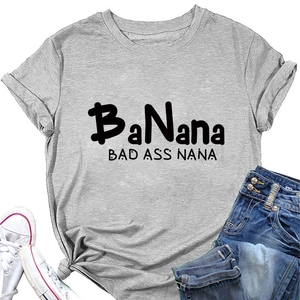 Flat lay of gray cotton t-shirt with BaNana print paired with denim shorts and sneakers