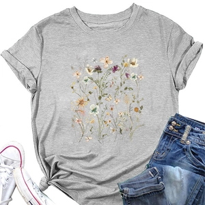Flat lay of gray floral print T-shirt with a stylish knotted hem and denim shorts
