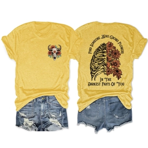 Detailed front and back view of yellow T-shirt with skull and floral graphic print