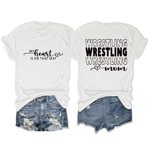 Flat lay of Wrestling Mom white cotton T-shirt with distressed denim shorts