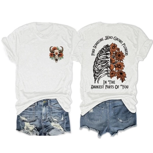 Detail of floral skeleton print on back of white cotton t-shirt with quotes