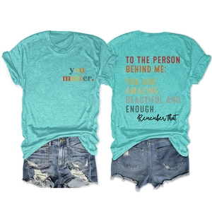 Detail view of mint green T-shirt with 'You Matter' text and motivational back print