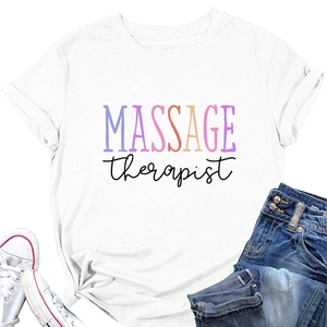 Flat lay of a white cotton t-shirt featuring a colorful Massage Therapist print design