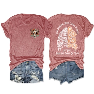 Detailed back and front views of pink knit t-shirt with floral skull print and quote