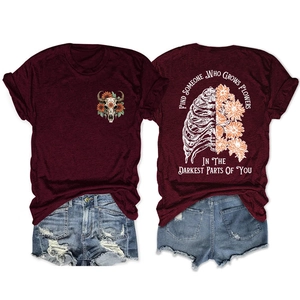 Detail of burgundy T-shirt showing sunflower bull skull and floral ribcage back print
