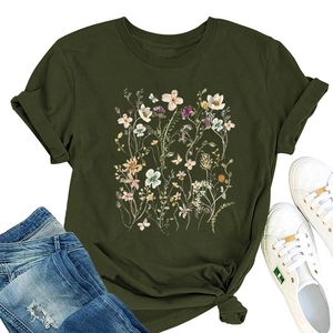 Detail of floral butterfly print on army green t-shirt with stylish side-knot hem