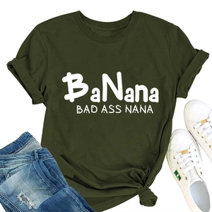 Flat lay of army green crew neck t-shirt with BaNana print paired with jeans and sneakers