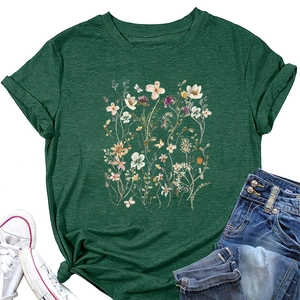 Flat lay of forest green floral t-shirt with rolled sleeves and front knot detail