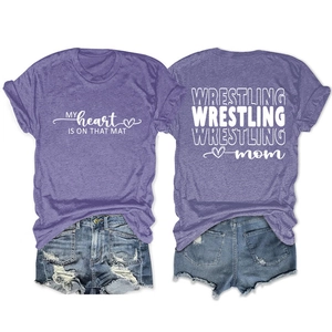 Flat lay of Wrestling Mom t-shirt and distressed denim shorts showing front and back designs