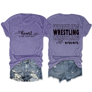 Front and back view of purple Wrestling Mom t-shirt and denim shorts set on white background