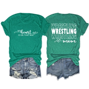 Detail of green Wrestling Mom t-shirt with back slogan print and casual denim shorts