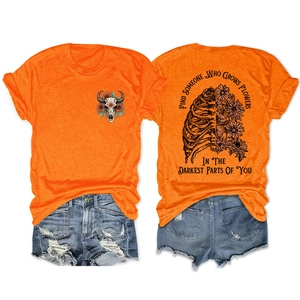 Front and back detail of orange cotton tee with floral skull and inspirational quote
