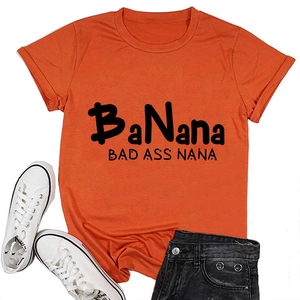 Flat lay of an orange crew neck t-shirt with BaNana Bad Ass Nana text print