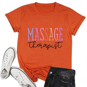 Flat lay detail of orange Massage Therapist t-shirt with shorts and white sneakers