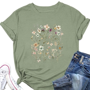 Detail of floral and butterfly print on green cotton T-shirt with casual styling