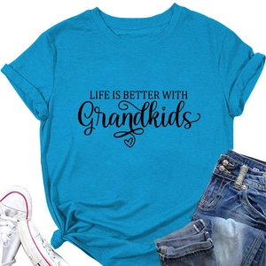 Detail of blue cotton T-shirt with Life is Better with Grandkids print and denim
