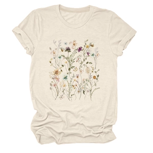 Close-up of beige short-sleeve T-shirt featuring vibrant floral print and rolled cuffs