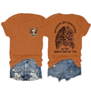 Detailed back print of a vintage caramel t-shirt featuring skeleton ribs and daisy flowers