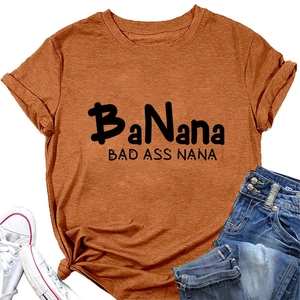 Flat lay of caramel Bad Ass Nana cotton t-shirt with jeans and white canvas shoes