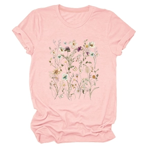 Detail of pink short sleeve tee showing delicate field flower print and rolled cuffs