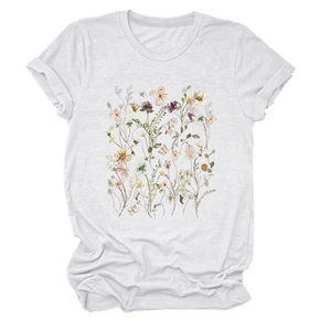 Detail of floral and butterfly watercolor print on a white crewneck cotton T-shirt
