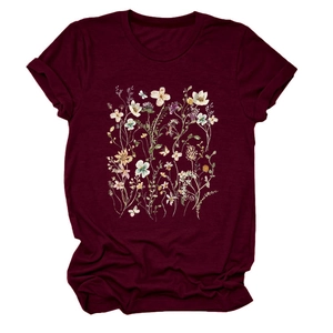 Detailed close-up of floral and butterfly print on a burgundy crew neck cotton T-shirt